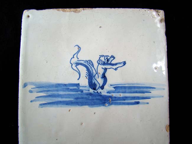 A Dutch Delft tile with sea creature circa 1700